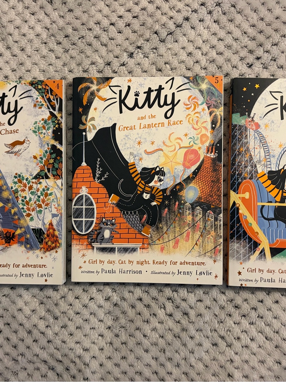 Kitty and the Great Lantern Race Decorative Book Art Print - Orange & Black